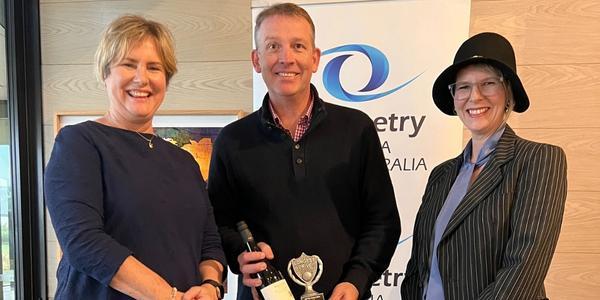 Longest Drive Men's winner Andrew Soblewski (centre), with Kylie and Ilsa.