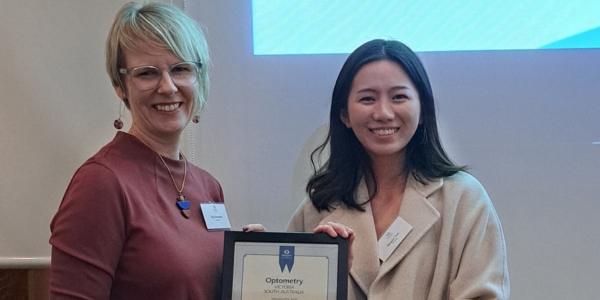 megan teh receiving award from Ilsa Hampton