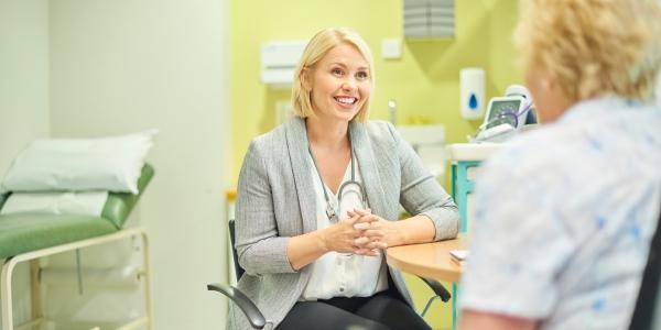 GP speaks to an elderly patient