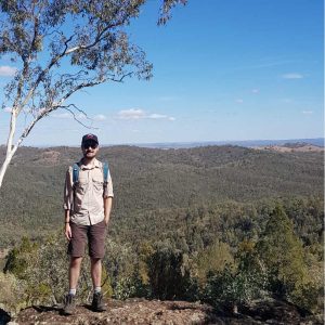 Man standing on rock in bushland