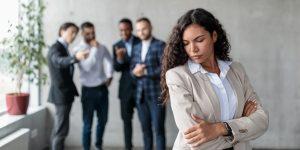 person harassed by colleagues feeling sad