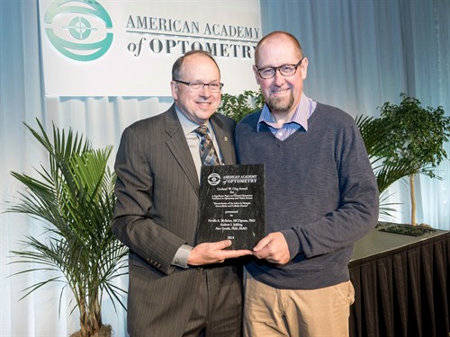 Alex Gentle, R, receiving the Clay award from Bernard Dolan